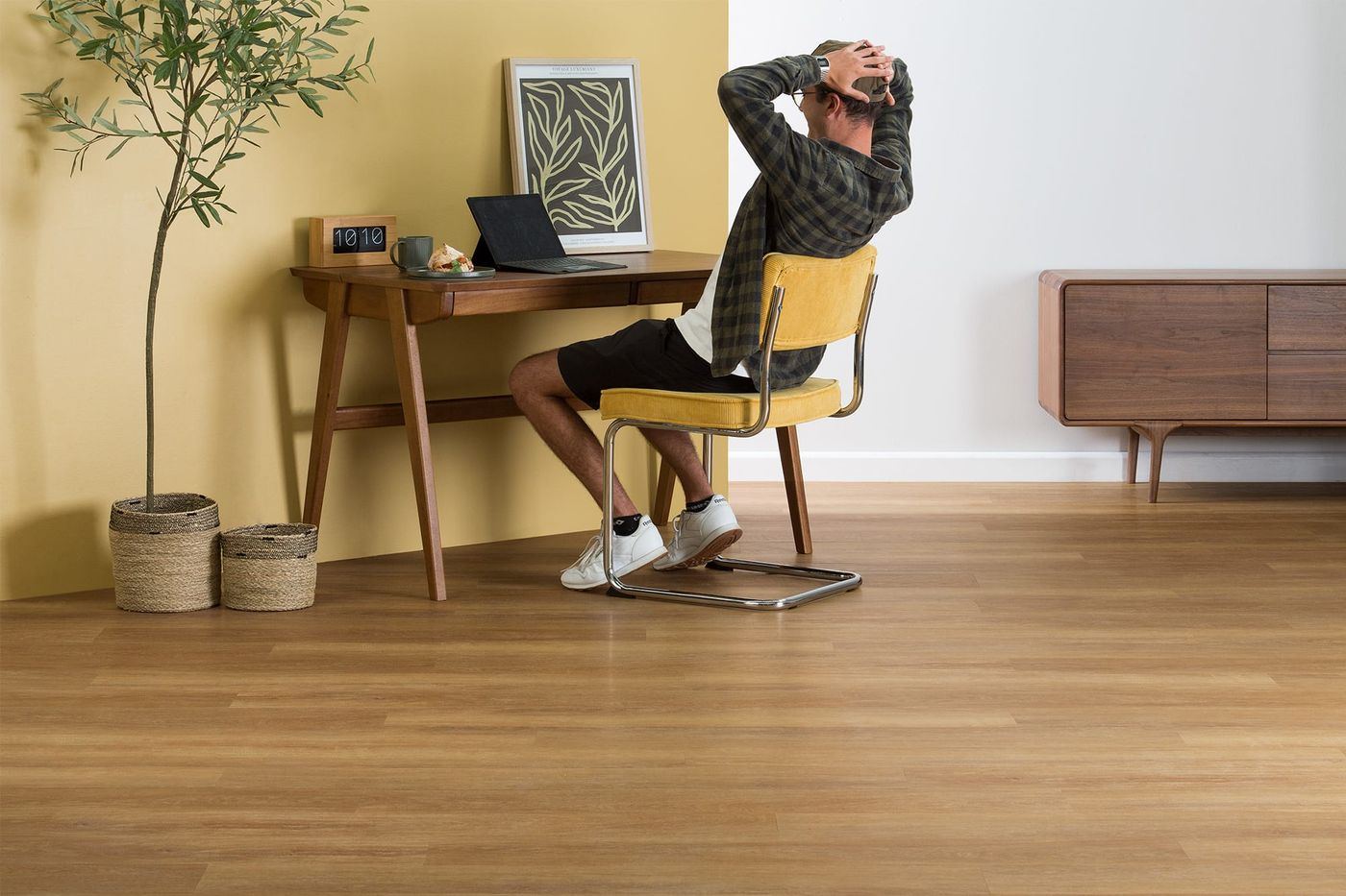 Home office with a mid-tone timber-look floor
