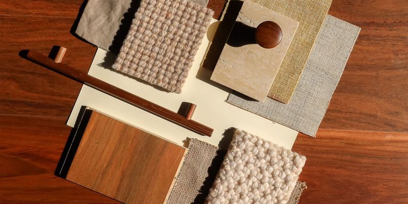 Carpet, timber and stone samples laid out on a table