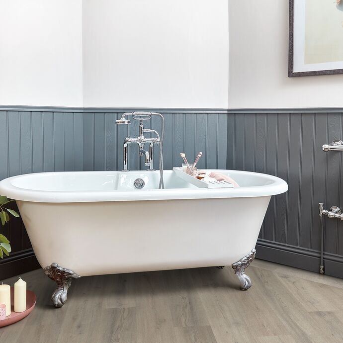 Bathroom with a freestanding bath on a timber-look vinyl floor